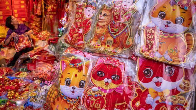 Stickers with cat image are on display at a Tet fair in the Old Quarter in Hanoi, Vietnam